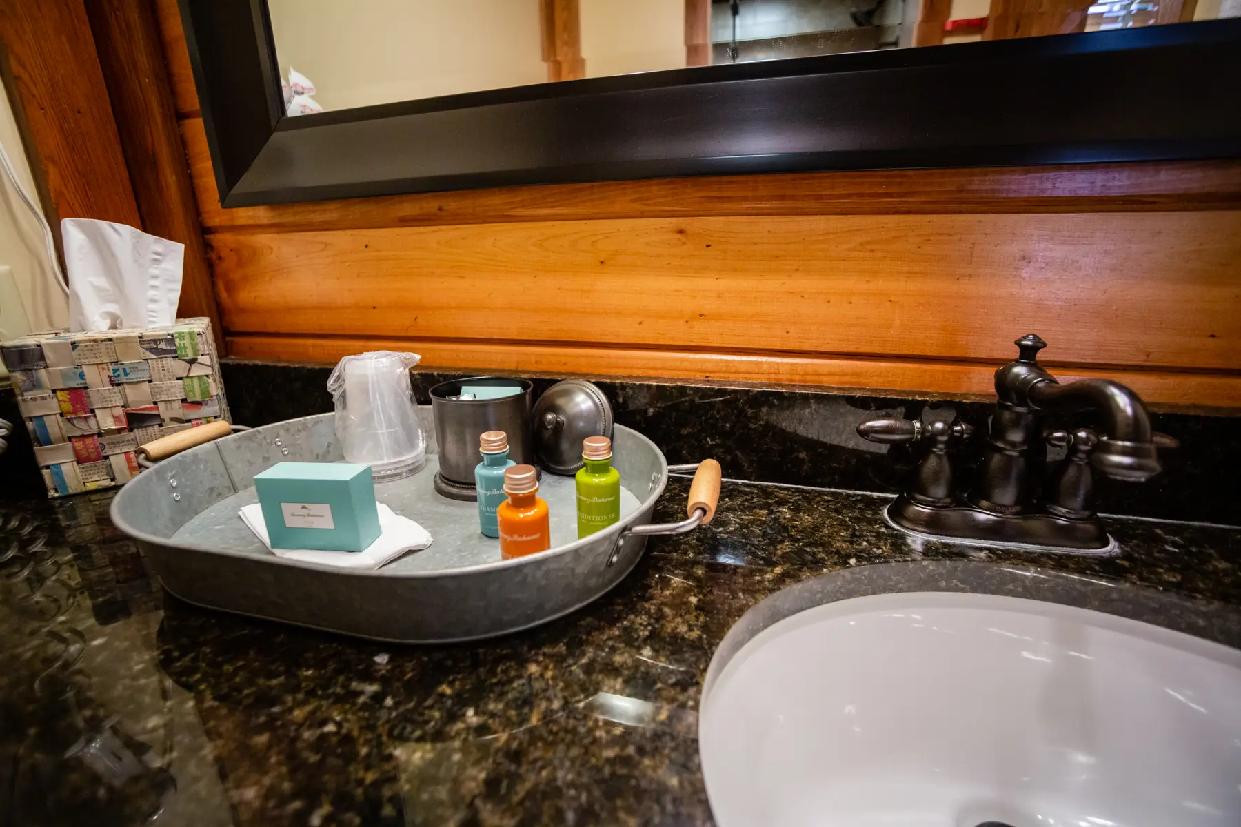 Toiletries and grooming items neatly arranged on a bathroom counter.