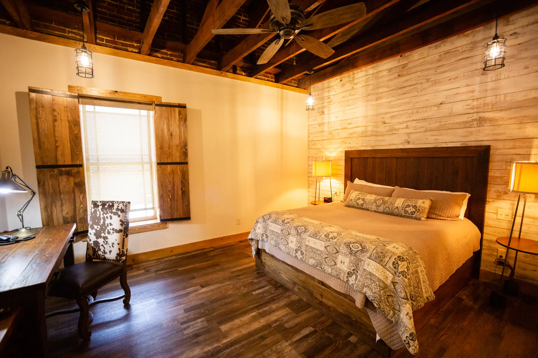 Cozy bedroom with wooden accents and warm lighting.