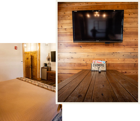 Rustic living room with wooden wall and TV mounted above a vintage wooden box.