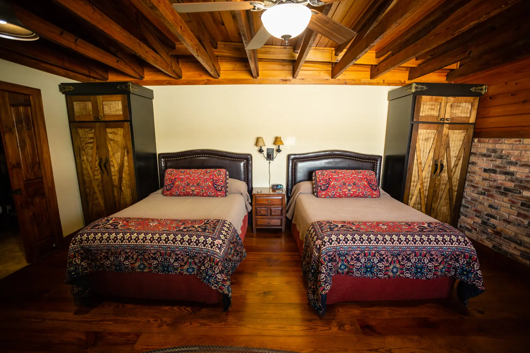 Cozy bedroom with twin beds and wooden accents.