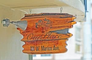 Our Place Hotel Sign